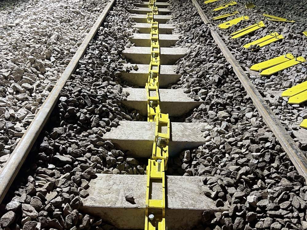 Ballasted track with lateral end resistance plates fitted, Network Rail